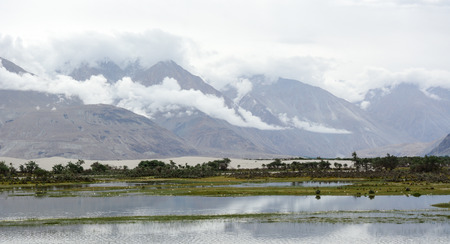 Mountain scenery with cloudscape in Leh, Ladakh, India. Ladakh is the highest plateau in the state of Jammu & Kashmir with much of it being over 3,000m.の写真素材