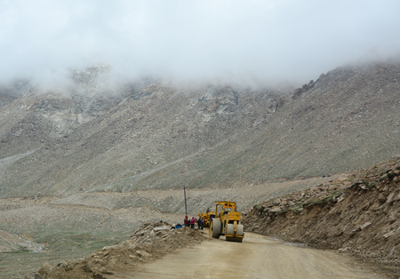 Ladakh, India - Jul 18, 2015. A road-roller working on mountain road in Leh, Ladakh, India. Ladakh...