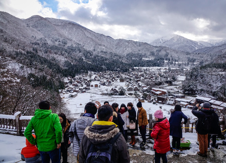 Gifu, Japan - Dec 29, 2015. People visit Historic Village of Shirakawago at winter in Gifu, Japan. Shirakawa-go on the Hida Highlands was registered as cultural heritage sites in 1995.のeditorial素材