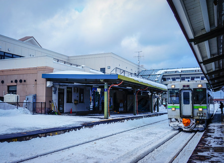 Yoichi, Japan - Feb 4, 2015. A train stopping at railway station in Yoichi, Hokkaido, Japan. Yoichi is the home of the Yoichi distillery owned by Nikka Whisky Distilling.のeditorial素材