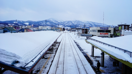 Yoichi, Japan - Feb 4, 2015. People waiting at railway station in Yoichi, Hokkaido, Japan. Yoichi is the home of the Yoichi distillery owned by Nikka Whisky Distilling.のeditorial素材
