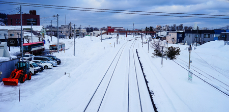 Yoichi, Japan - Feb 4, 2015. Rail tracks with snow at winter in Yoichi, Hokkaido, Japan. Yoichi is the home of the Yoichi distillery owned by Nikka Whisky Distilling.のeditorial素材