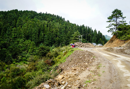 Thimphu, Bhutan - Aug 30, 2015. Vehicles running on the dangerous mountain road in Thimphu, Bhutan. Thimphu is the capital and largest city of the Kingdom of Bhutan.のeditorial素材