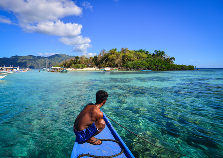 Coron, Philippines - Apr 9, 2017. A tour guide on boat in Coron, Philippines. Coron is the third-largest island in the Calamian Islands in northern Palawan in the Philippines.のeditorial素材