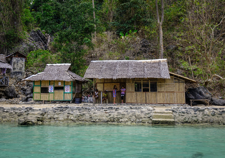 Coron, Philippines - Apr 9, 2017. Wooden houses at Kayangan Lagoon in Coron, Philippines. Kayangan Lake, located in Coron Island, is one of the most visited sites in Coron.のeditorial素材
