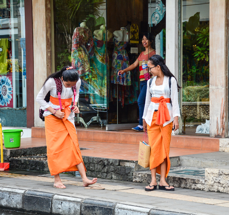 Bali, Indonesia - Apr 21, 2016. Young women walking on street in Bali, Indonesia. Bali is a popular tourist destination, which has seen a significant rise in tourists.のeditorial素材