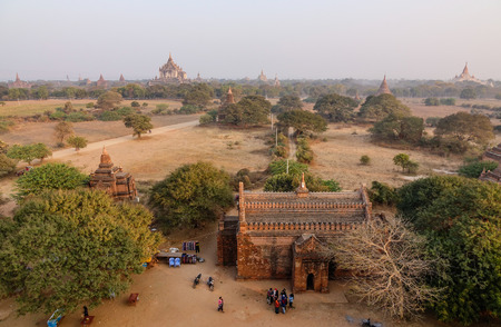 Bagan, Myanmar - Feb 17, 2016. Many people visit Buddhist temples in Bagan, Myanmar. Bagan is one of the world greatest archeological sites, a sight to rival Machu Picchu or Angkor Wat.のeditorial素材