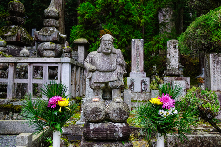 Koyasan, Japan - Nov 24, 2016. God statues with graves at forest in Mount Koya, Japan. Koyasan is primarily known as the world headquarters of the Shingon sect of Buddhism.のeditorial素材