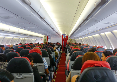 Kuala Lumpur, Malaysia - Jan 3, 2017. Passengers sitting inside the AirAsia airplane in Kuala Lumpur, Malaysia.のeditorial素材