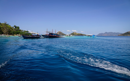 Palawan, Philippines - Apr 11, 2017. Wooden boats docking on the blue sea at sunny day in Palawan, Philippines. The Palawan coast is one of the most unspoilt places in the world.のeditorial素材