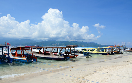 Lombok, Indonesia - Apr 18, 2016. Wooden boats at the tourist jetty in Lombok, Indonesia. Lombok, an island next to Bali where the tourism is still in its infancy.のeditorial素材