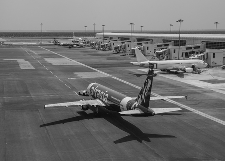 Kuala Lumpur, Malaysia - Apr 13, 2016. AirAsia airplane docking at KLIA2 Airport in Kuala Lumpur, Malaysia. KLIA2 is the world largest purpose-built terminal dedicated for low-cost carrier.のeditorial素材