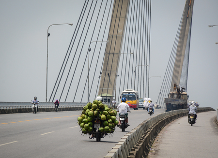 Hai Phong, Vietnam - May 21, 2016. People and vehicles on the Binh Bridge in Hai Phong, Vietnam. Hai Phong is a major port city in northeastern Vietnam, across from Cat Ba Island.のeditorial素材