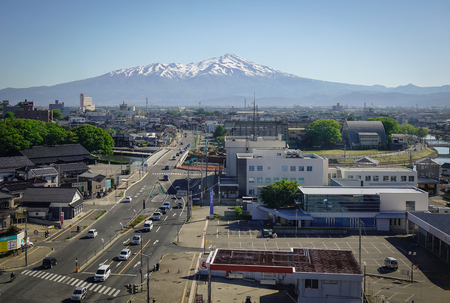 Sakata, Japan - May 19, 2017. Aerial view of Sakata City with snow mountain in Tohoku, Japan. Sakata City flourished thanks to a thriving safflower trade during the Edo Period.のeditorial素材
