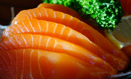Salmon raw sashimi on wooden table at local restaurant in Kyoto, Japan.の写真素材