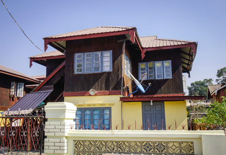 Facade of a wooden house at downtown in Pyin Oo Lwin, Myanmar. The small town of Pyin Oo Lwin is a reminder of the British colonial times in Myanmar.のeditorial素材