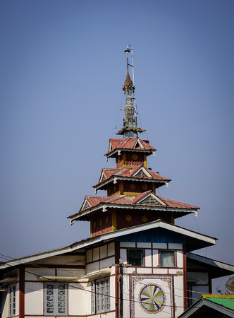 Top of wooden temple at downtown in Pyin Oo Lwin, Myanmar. The small town of Pyin Oo Lwin is a reminder of the British colonial times in Myanmar.の写真素材