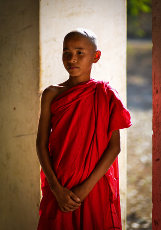 Portrait of Buddhist novice at an ancient temple in Bagan, Myanmar. Bagan is an ancient city that was the capital of the first Burmese empire.のeditorial素材