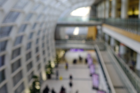 Airport terminal blur background with bokeh lightの写真素材