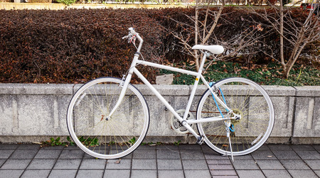 A white bicycle parking on street at downtown in Tokyo, Japan.の写真素材