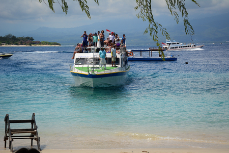 Lombok, Indonesia - Apr 19, 2016. A ferry coming to tourist jetty in Lombok Island, Indonesia. Lombok is an island next to Bali where the tourism is still in its infancy.のeditorial素材