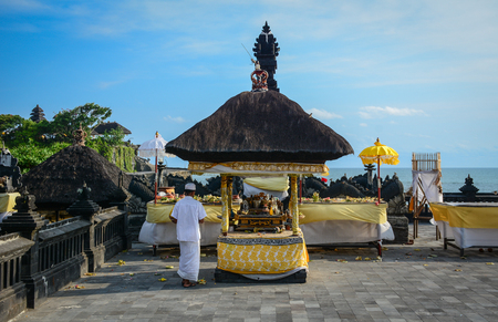 Bali, Indonesia - Apr 21, 2016. People praying at Elephant Cave Temple in Bali, Indonesia. Goa Gajah (Elephant Cave) is a Hindu temple located very close to Ubud in the hills of Bali.のeditorial素材