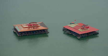 Cat Ba, Vietnam - May 22, 2016. Floating restaurants at Cat Ba Island in North of Vietnam. Cat Ba is an well-known archipelago with a spectacular array of sea and island scenery.のeditorial素材