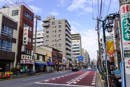 Tokyo, Japan - Dec 7, 2016. Cars running on street at Taito District in Tokyo, Japan. Tokyo urban area 38 million people had a total GDP of 2 trillion USD in 2012.のeditorial素材