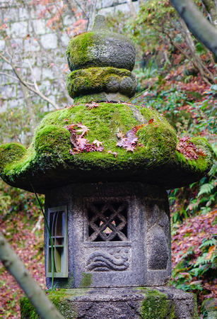 An ancient lantern at the autumn garden in Kyoto, Japan. Kyoto served as Japan capital and the emperor residence from 794 until 1868.の写真素材