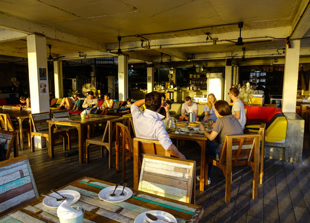 Bangkok, Thailand - Jun 16, 2017. People sitting at the river view restaurant in Bangkok, Thailand....