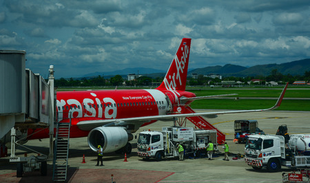 Chiang Mai, Thailand - Jun 22, 2016. AirAsia aircraft docking at Chiang Mai Airport in Thailand. In...