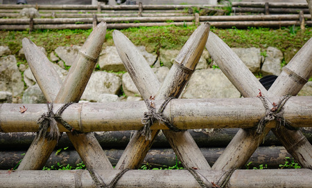 Closeup of Japanese wooden fence at sunny day in the Buddhist temple.の写真素材