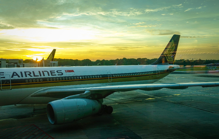 Singapore - Jun 14, 2017. Civil aircrafts docking at Changi Airport in Singapore. Changi serves more than 100 airlines flying to some 380 cities in about 90 countries.のeditorial素材
