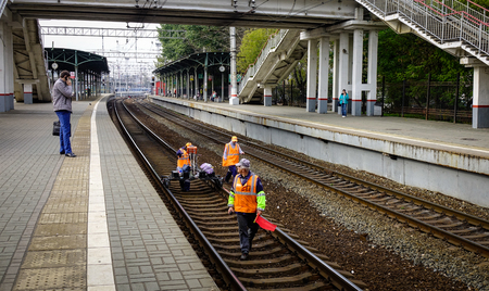 Moscow, Russia - Oct 3, 2016. Railway staffs work on the track in Moscow, Russia. Russian Railways,...