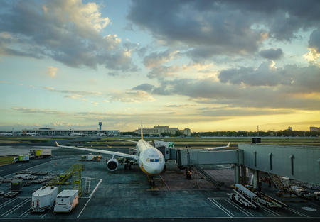 Manila, Philippines - Apr 14, 2017. A civil aircraft docks and waits at Terminal 3 of Ninoy Aquino Airport (NAIA) in Manila, Philippines. NAIA is the main intl gateway for travelers to the Philippines.のeditorial素材