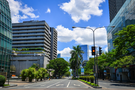 Manila, Philippines - Apr 14, 2017. View of Makati District with green trees in Manila, Philippines. Manila is a major center for commerce, banking, retailing, transportation and tourism.のeditorial素材