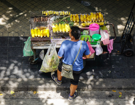 Bangkok, Thailand - Jun 17, 2017. A man selling street foods in Bangkok, Thailand. Bangkok, Thailand capital, is a large city known for ornate shrines and vibrant street life.のeditorial素材