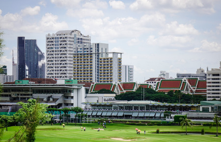 Bangkok, Thailand - Jun 17, 2017. View of a golf course with pagodas at sunny day in Bangkok, Thailand. Bangkok is a large city known for ornate shrines and vibrant street life.のeditorial素材