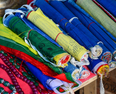 Tibetan praying flags for sale at a souvenir shop in Ladakh, India.の写真素材