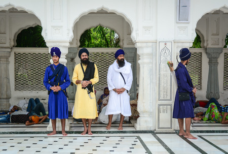 Amritsar, India - Jul 25, 2015. Sikh men standing at the Golden Temple in Amritsar, India. Golden temple is also known as Harmandir Sahib, a significant Sikh temple, which is located in Amritsar.のeditorial素材