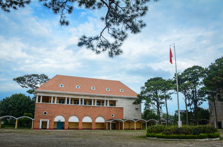 View of Ancient Lycee Yersin School with pine trees in Dalat, Vietnam. Da Lat is located on the Langbian Plateau in the southern parts of the Central Highlands.のeditorial素材