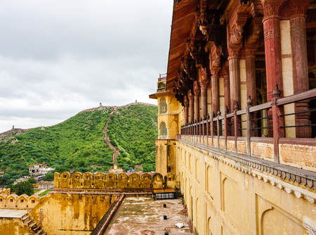 Part of Amer Fort with mountains background in Jaipur, India. In 16th century, the fort was built by a trusted general of Akbar, Maan Singh.のeditorial素材