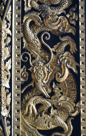 Golden dragon on the Chinese temple wall in Bangkok, Thailand.のeditorial素材