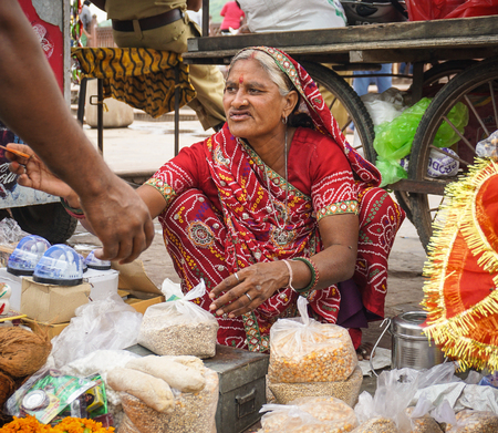 Jaipur, India - Jul 28, 2015. A vendor selling souvenir at street market in Jaipur, India. Jaipur is the capital and largest city of the Indian state of Rajasthan.のeditorial素材