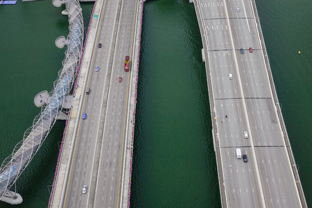 Singapore - Jun 13, 2017. Aerial view of highways and bridges in Singapore. Singapore is the third-largest financial centre, and the second-busiest container port.のeditorial素材