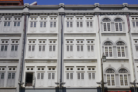 Singapore - Jun 13, 2017. Old buildings at sunny day in Chinatown, Singapore. Chinatown is a bustling mix of old and new, filled with traditional shops and night markets.のeditorial素材