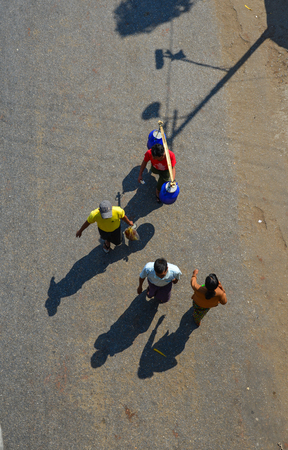 Yangon, Myanmar - Feb 13, 2017. Burmese people walking on street in Yangon, Myanmar. Yangon is Myanmar largest city and its most important commercial centre.のeditorial素材