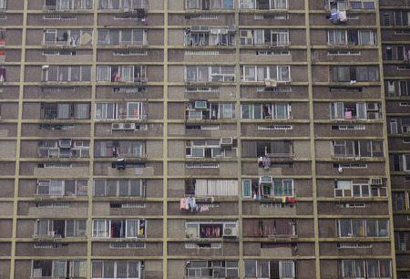 Hong Kong - Mar 30, 2017. Facade of old apartment at downtown in Hong Kong. Hong Kong is an important hub in East Asia with global connections to many of the world cities.のeditorial素材