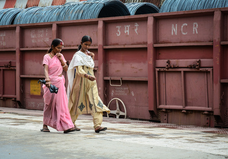 Bodh Gaya, India - Jul 9, 2015. Indian women walking on street in Bodhgaya, India. Bodhgaya (Bodh Gaya) is the site of the Buddha enlightenment and the holiest of four main Buddhist.のeditorial素材