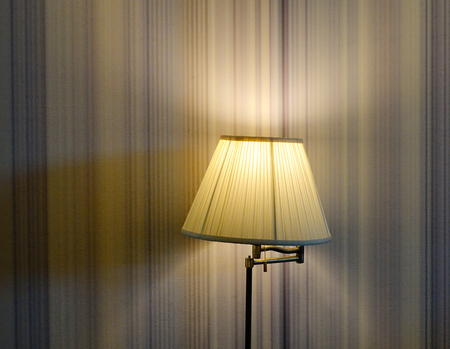 Elegant lamp with yellow light at living room of modern house.の写真素材